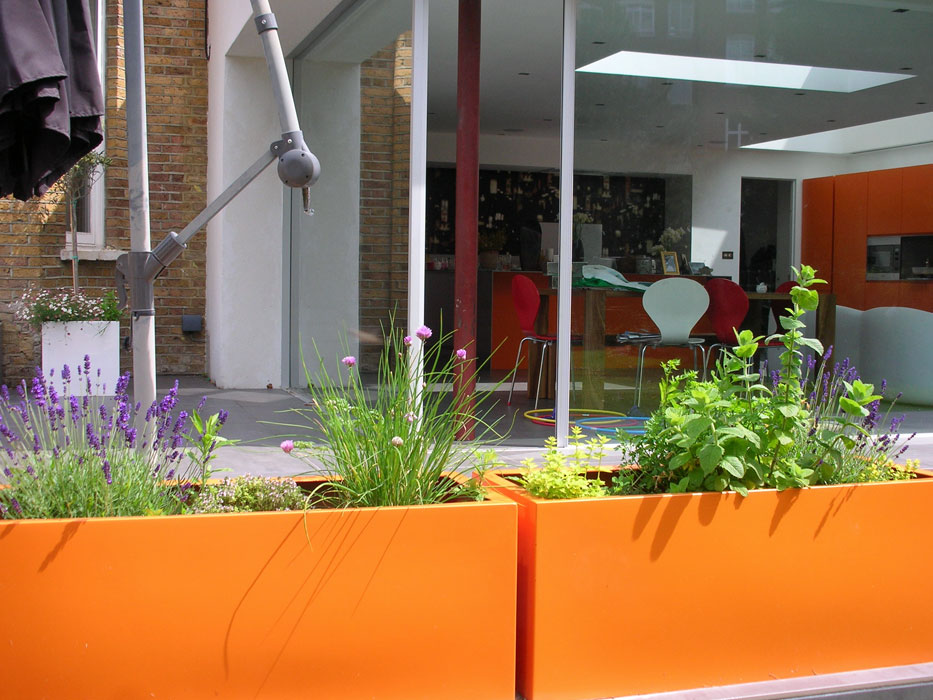 Orange planters mirror kitchen units